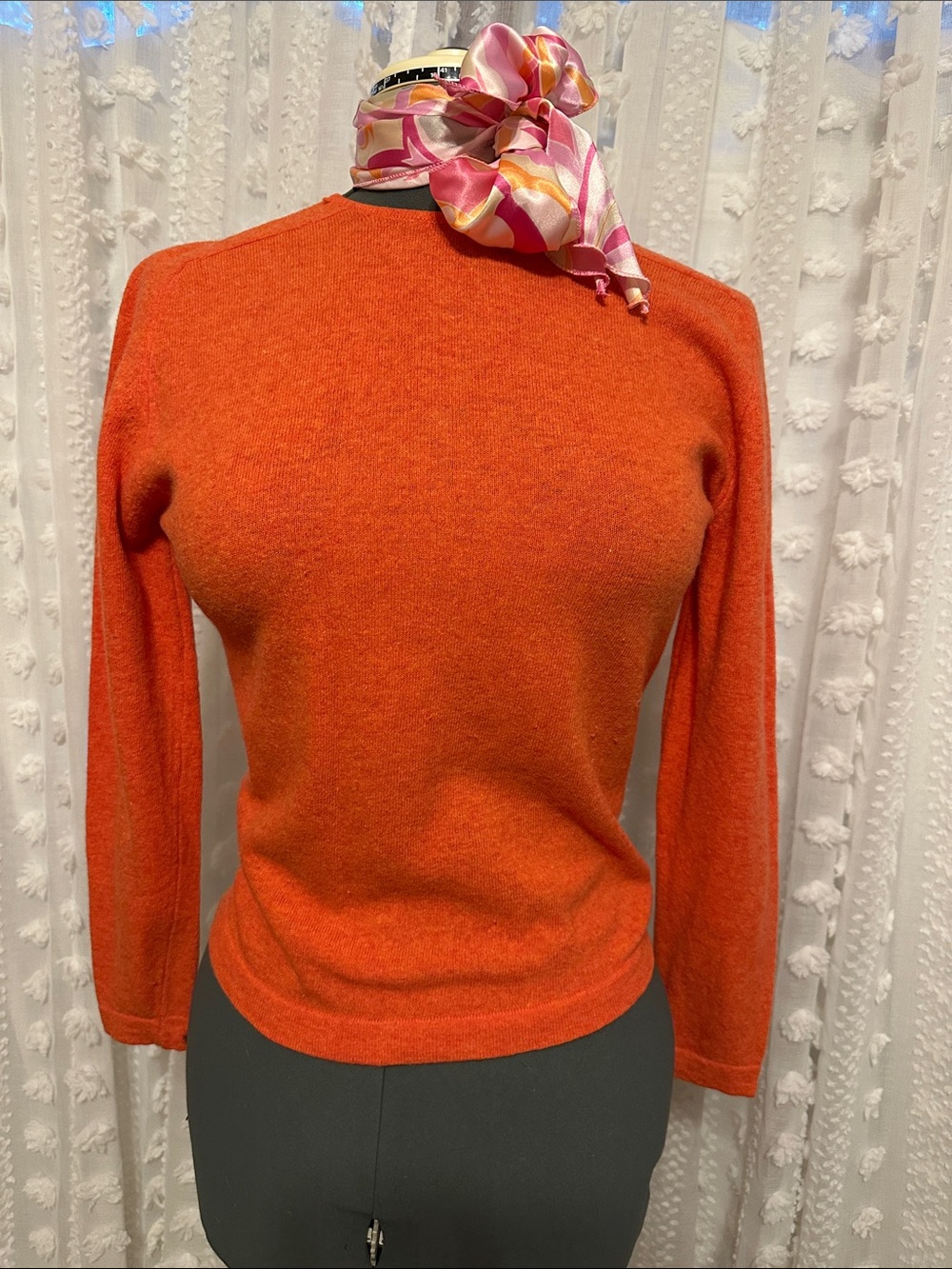 Vintage Bobbie Brooks Bright Orange Crewneck Sweater with accessories.